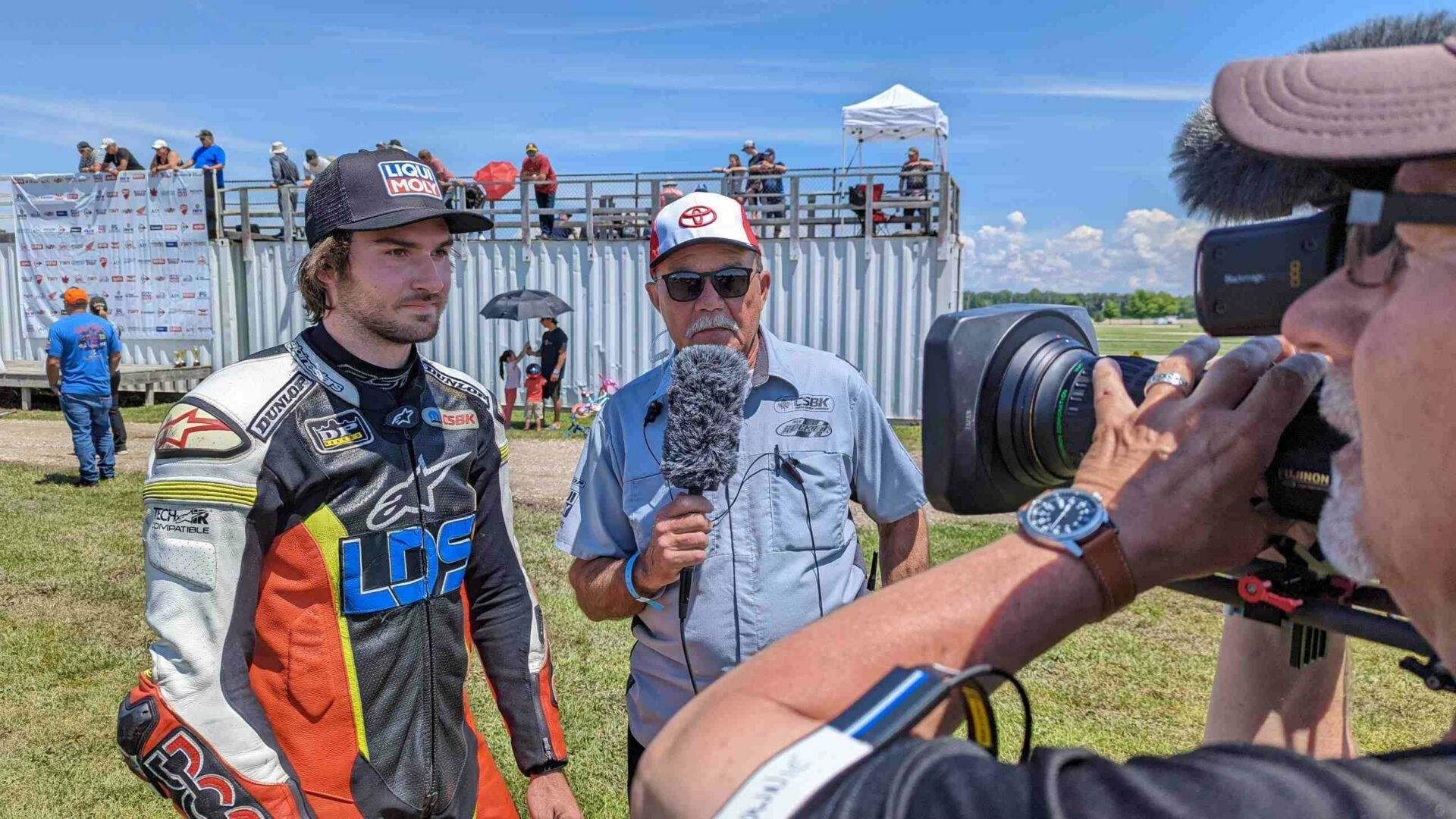 BS Batteries Pole Award winner Trevor Dion discusses his Grand Bend performance with TSN Host Frank Wood under the watchful eye of camera man Michael Brown. Photo by Colin Fraser, courtesy CSBK/PMP.