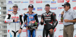 Canadian Superbike racers (from left) Ben Young, Alex Dumas, and Trevor Daley join series announcer Frank Wood in announcing the Canadian Rider Fund raffle of a Fabio Quartararo-autographed Scorpion race helmet, at Atlantic Motorsport Park. Photo by Rob O'Brien, courtesy CSBK/PMP.