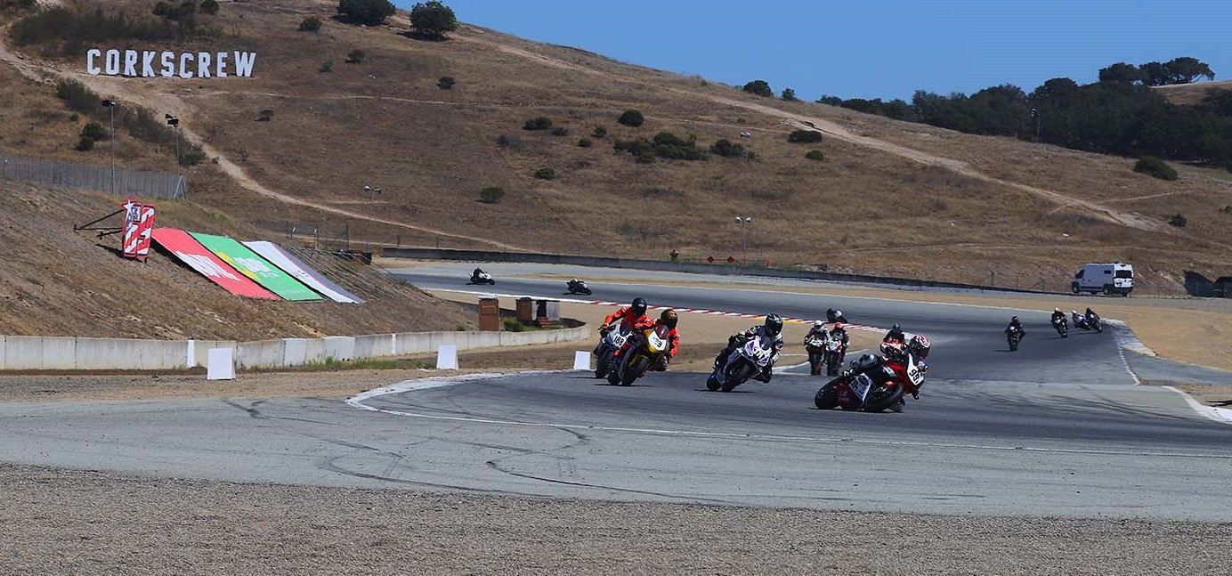 Todd Murray (99T) leads Ray Hoffman (771), Luke Luciano (188), Troy Siahaan (123), and the rest of the field into Turn 11 during the Sound of Thunder 2 race July 17 at WeatherTech Raceway Laguna Seca. Photo by etechphoto.com, courtesy AHRMA.