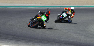 Mark Miller (10M) leading Curtis Adams (045) in a Vintage Cup race at Laguna Seca. Photo by etechphoto.com, courtesy AHRMA.