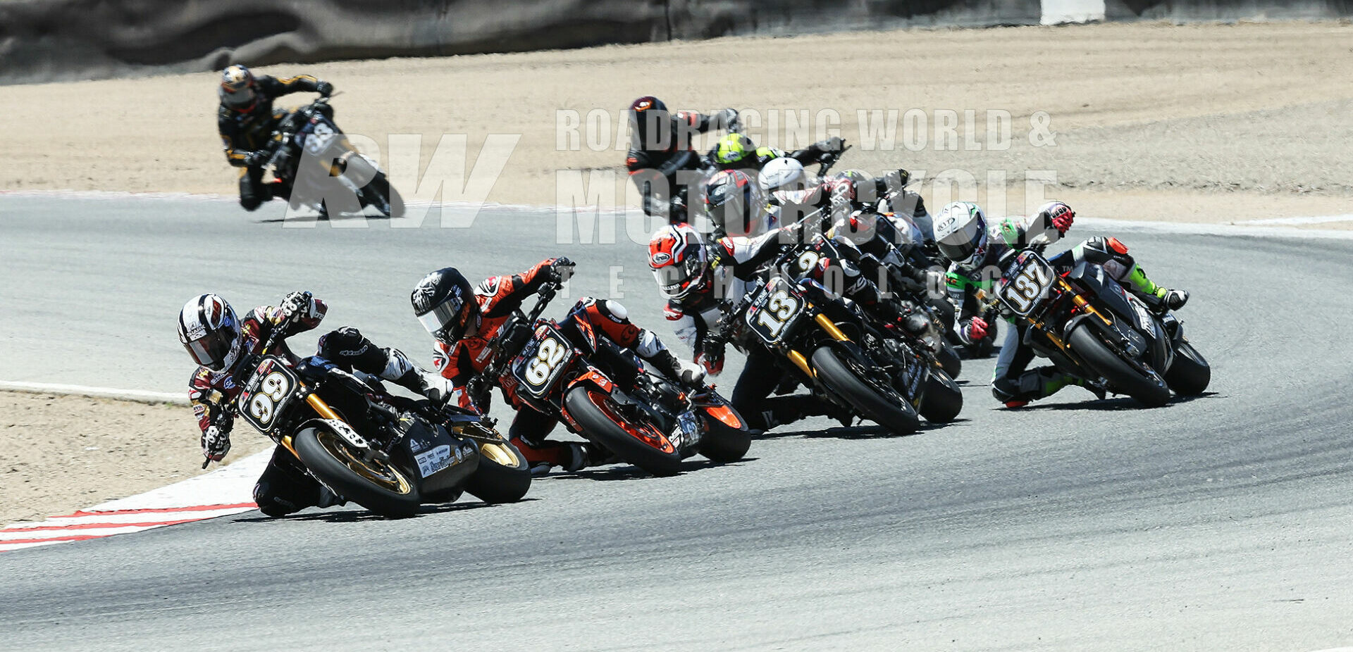 Early in the RSD Super Hooligans race at Laguna Seca, Stefano Mesa (137) on an Energica electric bike chased Jeremy McWilliams (99), Andy DiBrino (62), and Cory West (13), and led Tyler O'Hara, Nate Kern, Alex Taylor, and Josh Baird. Mesa raced Kern and Baird for sixth until slowing on the last lap with hot batteries, and finished 13th. Photo by Brian J. Nelson.