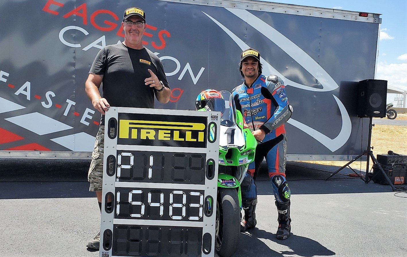 JC Camacho (right) with John Hutchinson (left) of Pirelli’s trackside racing tire vendor South Central Race Center. Photo courtesy Pirelli.