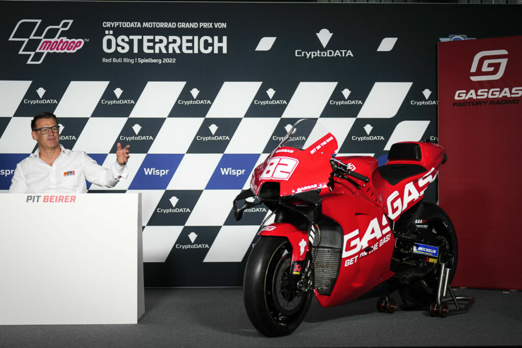 Pit Beirer, GASGAS Motorsports Director, with a GASGAS-branded KTM RC16 at a press conference at Red Bull Ring. Photo courtesy Dorna.