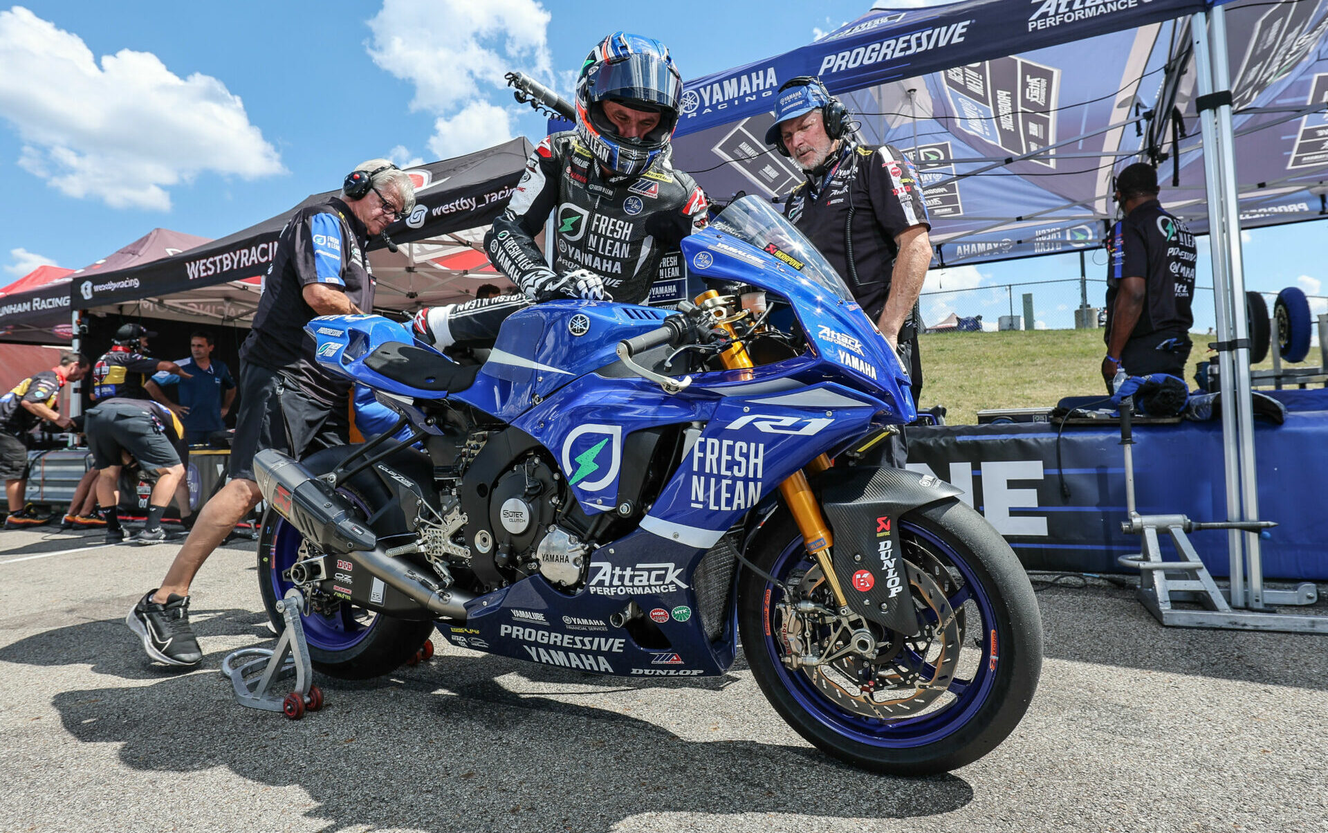 Jake Gagne with crew members Walker Jemison (right) and Mike Canfield (left) at Pittsburgh International Race Complex. Photo by Brian J. Nelson.