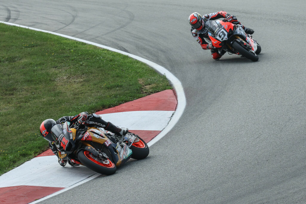 Mathew Scholtz (11) leading Danilo Petrucci (9) during MotoAmerica Superbike Race Two at PitttRace. Photo by Brian J. Nelson, courtesy Westby Racing.