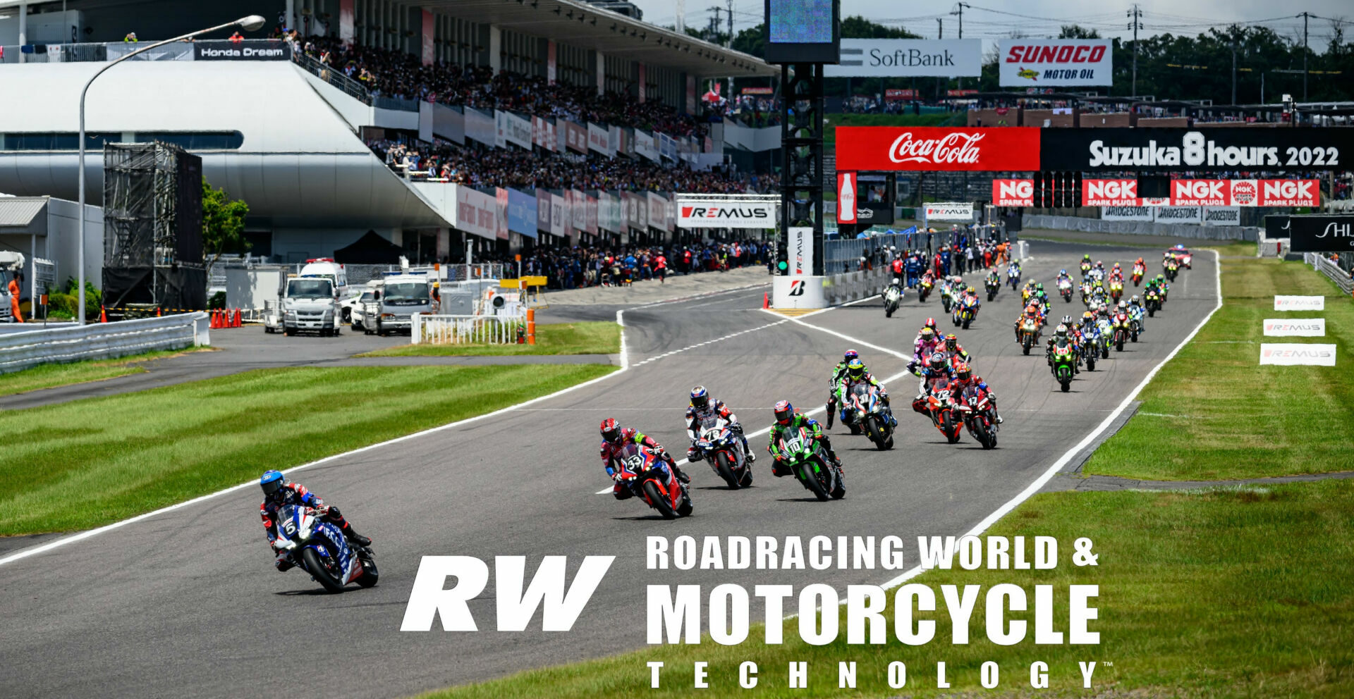 The start of the 43rd Suzuka 8-Hours race with F.C.C. TSR Honda France (5) leading Team HRC (33) and Kawasaki Racing Team Suzuka 8H (10) into Turn One. Photo by Kohei Hirota.