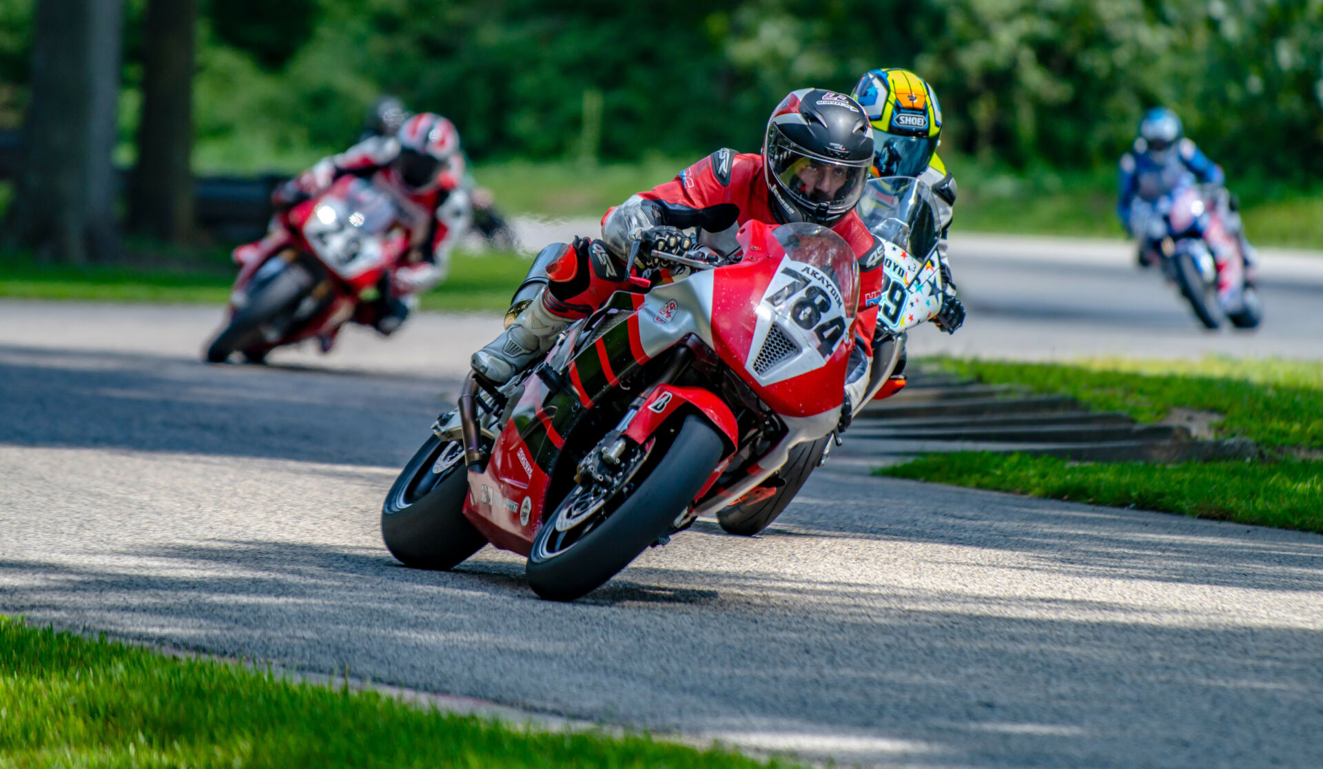 Christopher Akaydin (784), riding a 2004 Honda RC51, leads J. Scott Rothermel (291) and his 1995 Ducati 916 during Saturday's NextGen Superbike 2 race at Blackhawk Farms Raceway. Photo courtesy Kevin McIntosh, courtesy AHRMA.