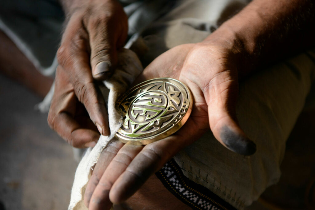 The exquisite die-cast brass tank badges are crafted in collaboration with the Sirpi Senthil family, multi-generational artisans from the temple town of Kumbakonam, Tamil Nadu, India. Photo courtesy Royal Enfield North America.