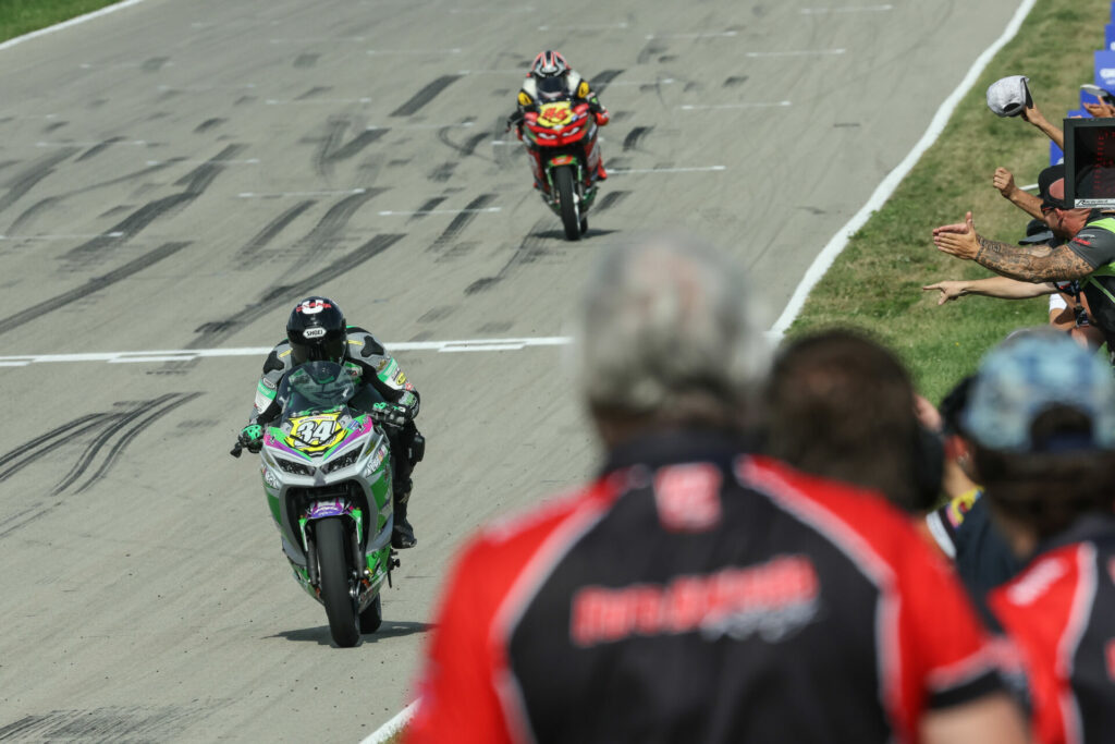 Cody Wyman (34) leads Gus Rodio (96) across the finish line to win SportbikeTrackGear.com Junior Cup Race One. Photo by Brian J. Nelson, courtesy MotoAmerica.