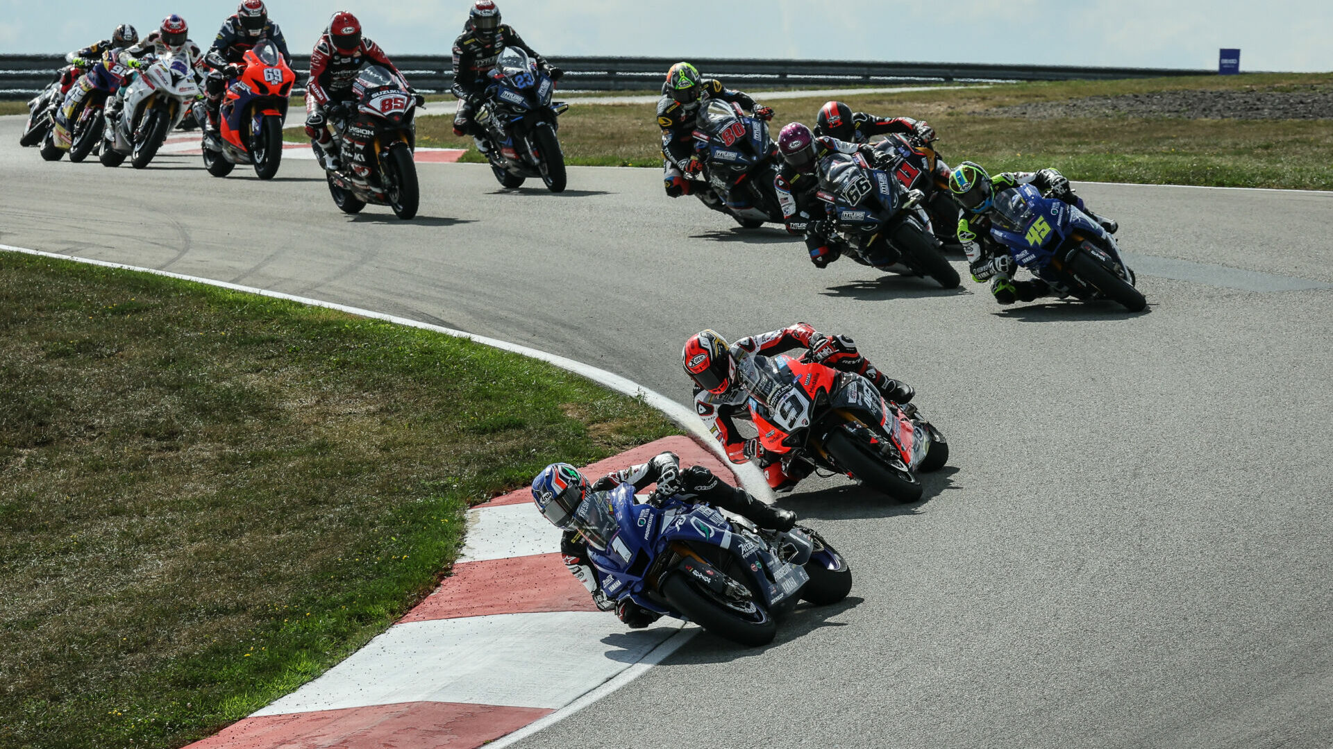 Jake Gagne (1) leads Danilo Petrucci (9) early in one of the three starts during MotoAmerica Superbike Race One Saturday at PittRace. Photo by Brian J. Nelson, courtesy MotoAmerica.