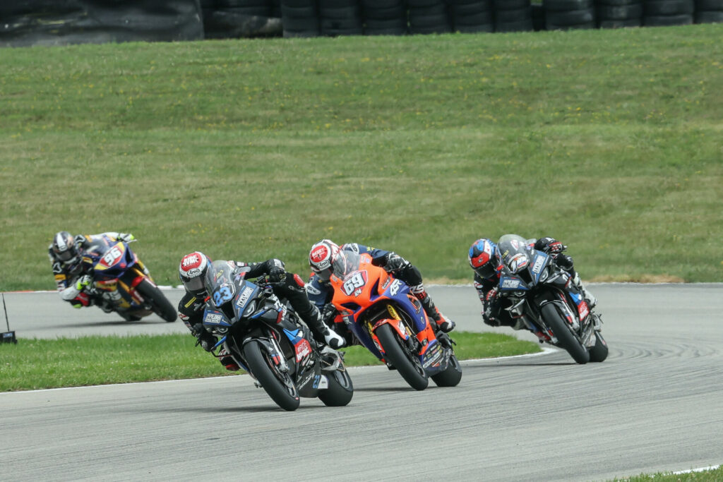 Corey Alexander (23) and Hayden Gillim (69) had a heated battle in Yuasa Stock 1000 with Gillim crashing out of the race on the final lap. Travis Wyman (10) inherited second place. Photo by Brian J. Nelson, courtesy MotoAmerica.