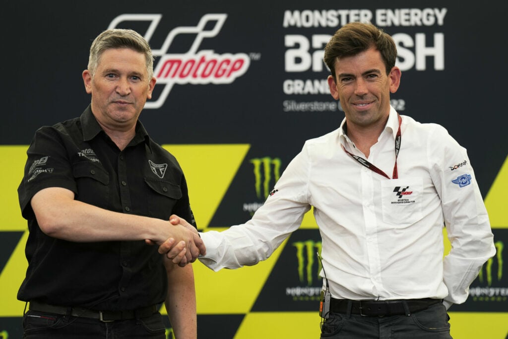 Triumph Chief Product Officer Steve Sargent (left) with Dorna Managing Director Carlos Ezpeleta (right) at a press conference Thursday at Silverstone. Photo courtesy Dorna.