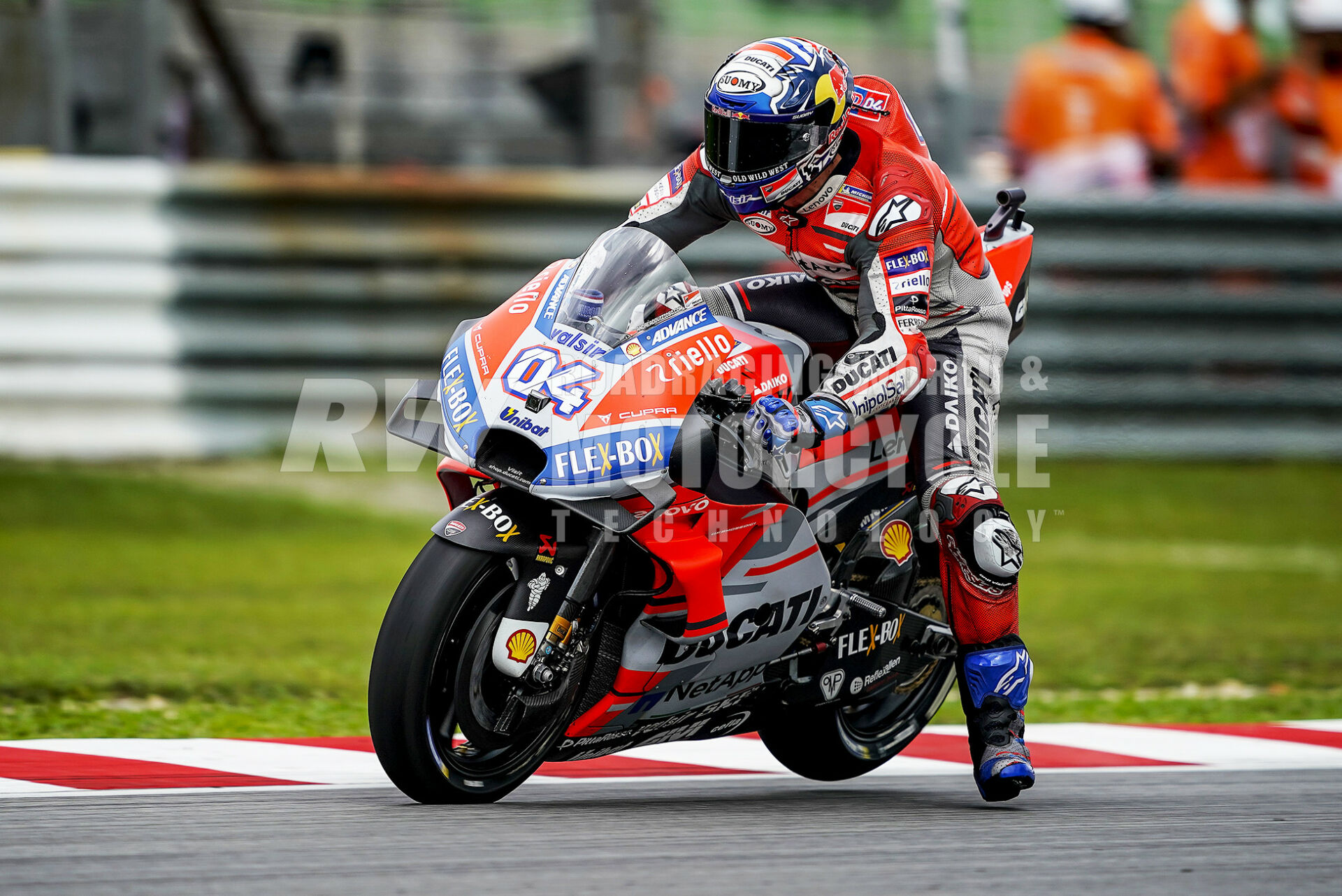 Andrea Dovizioso (04) hard on the brakes in 2018 with the forks bottomed out and the rear wheel in the air. Riders who tried to out-brake him did so at their own peril. Photo courtesy Ducati Corse.