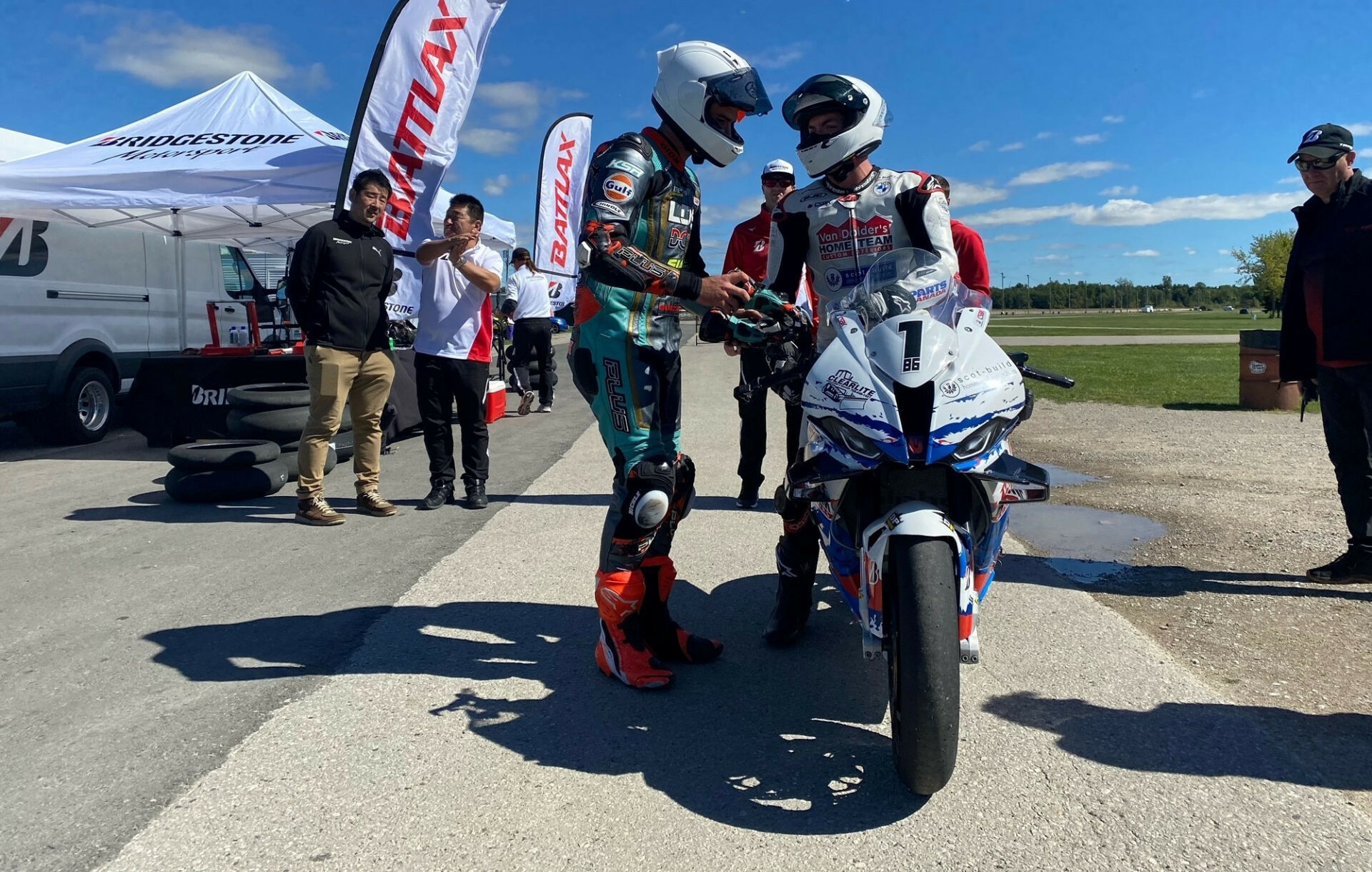 Canadian Superbike Champion Ben Young (on motorcycle) and Canadian Sport Bike Champion Trevor Dion (standing) tested Bridgestone tires under the supervision of Bridgestone engineers at Grand Bend Motorplex, in Ontario. Photo by Ross Millson, courtesy CSBK/PMP.