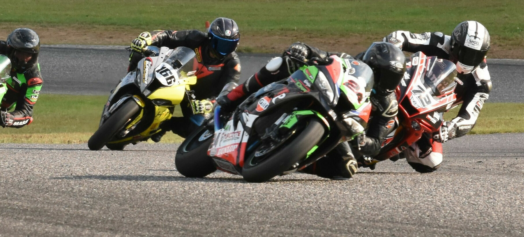 Sebastien Tremblay (24) denies a last-corner pass from Ernest Bernhard (72) with Marc Labossiere (166) and Cedric Leclair (889) close behind in the Pro 6 GP finale at Calabogie. Photo by Colin Fraser, courtesy CSBK/PMP.