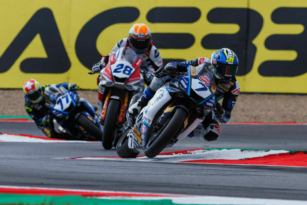 Lorenzo Baldassarri (7) leads Glenn van Straalen (28) and Dominique Aegerter (77) during World Supersport Race One at Magny-Cours. Photo courtesy Dorna.