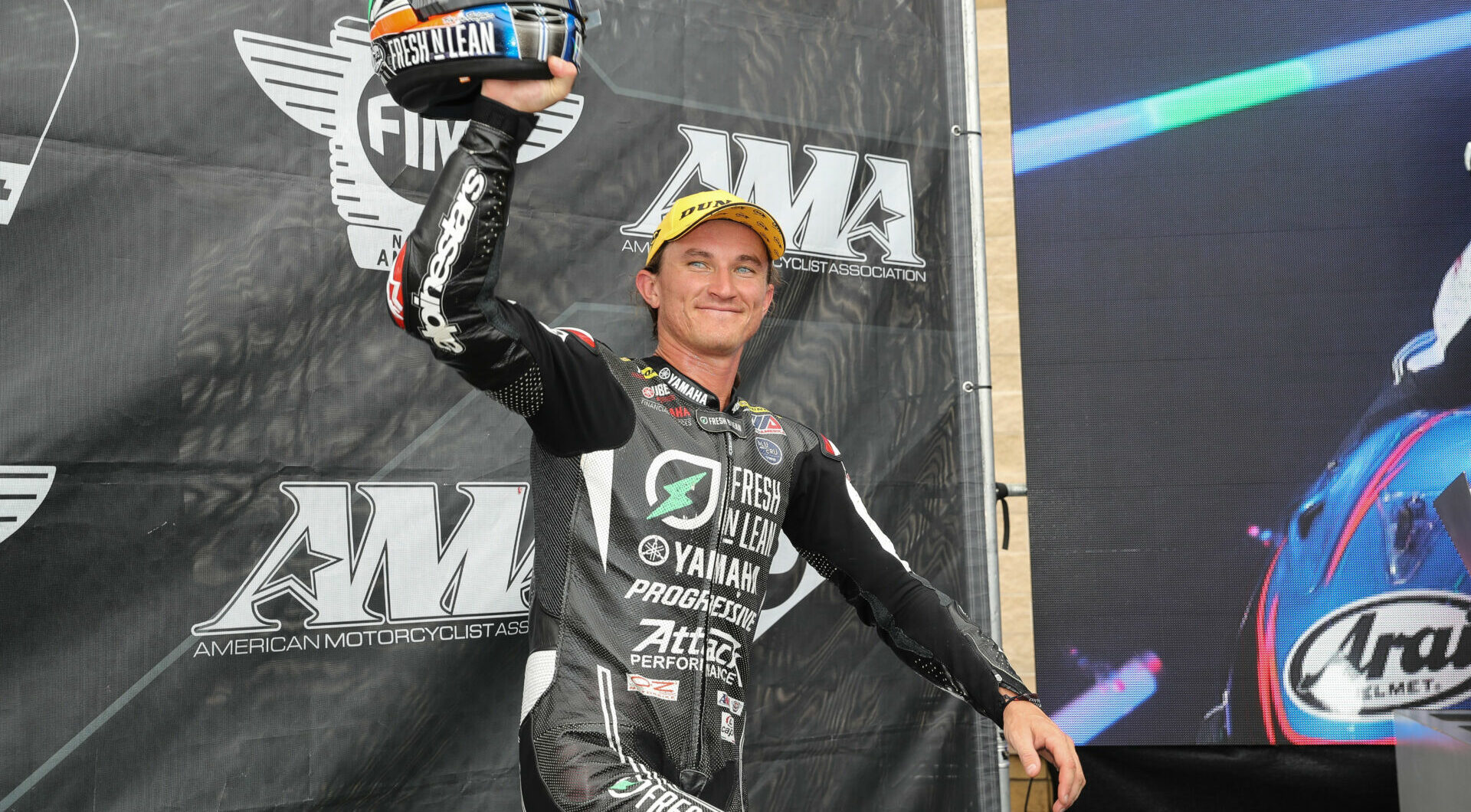 Reigning MotoAmerica Superbike Champion Jake Gagne on the podium at Pittsburgh International Race Complex. Photo by Brian J. Nelson.