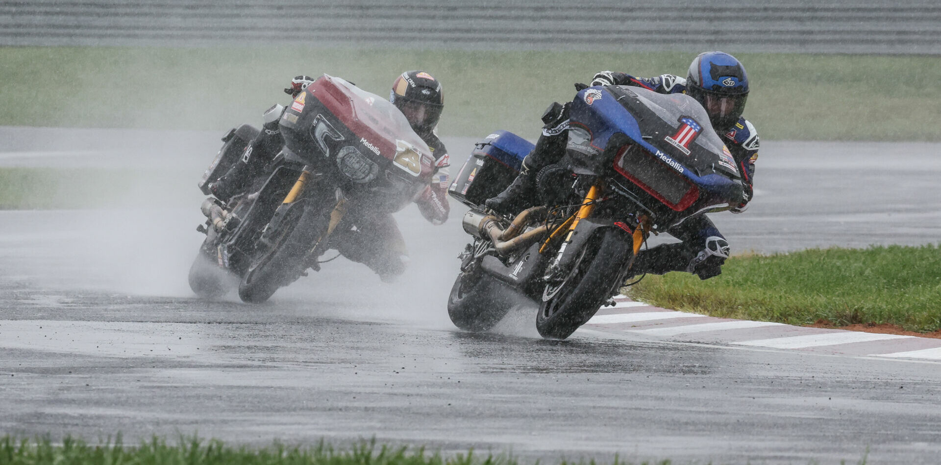 Kyle Wyman (1) and Tyler O'Hara (29) fight for the lead in the wet King Of The Baggers race. Photo by Brian J. Nelson, courtesy Harley-Davidson.