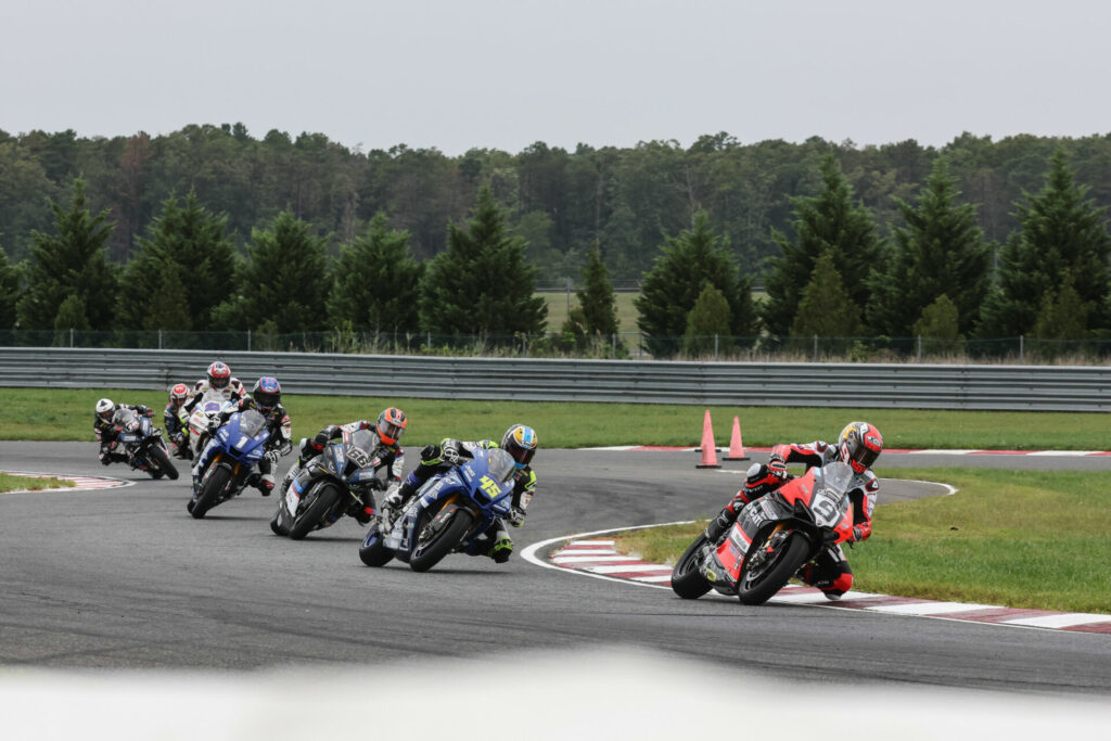 Danilo Petrucci (9) leads Cameron Petersen (45), PJ Jacobsen (66), Jake Gagne (1), Ashton Yates (22), Hayden Gillim (behind Yates), and Travis Wyman (10) early in MotoAmerica Superbike Race Two. Photo by Brian J. Nelson, courtesy Ducati North America.