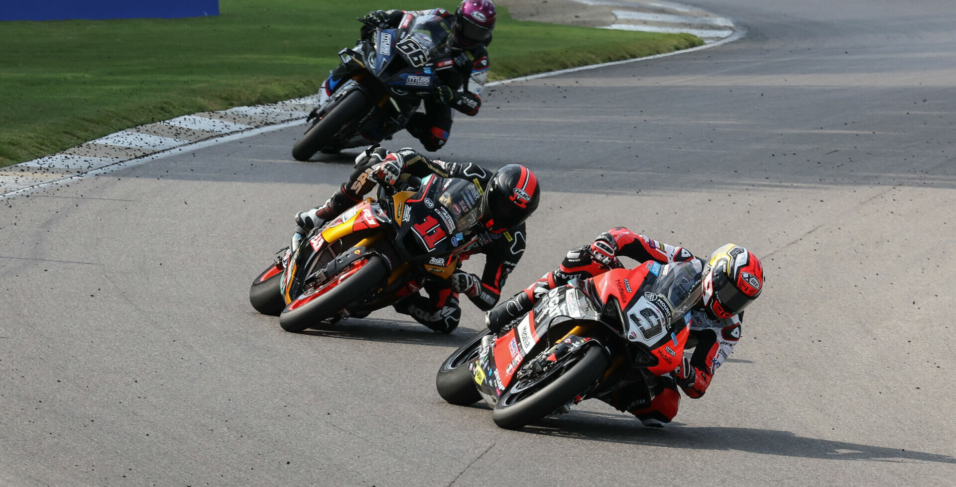 Danilo Petrucci (9) leads Mathew Scholtz (11) and PJ Jacobsen (66) in MotoAmerica Medallia Superbike Race Two at Barber Motorsports Park. Photo by Brian J. Nelson, courtesy Westby Racing.