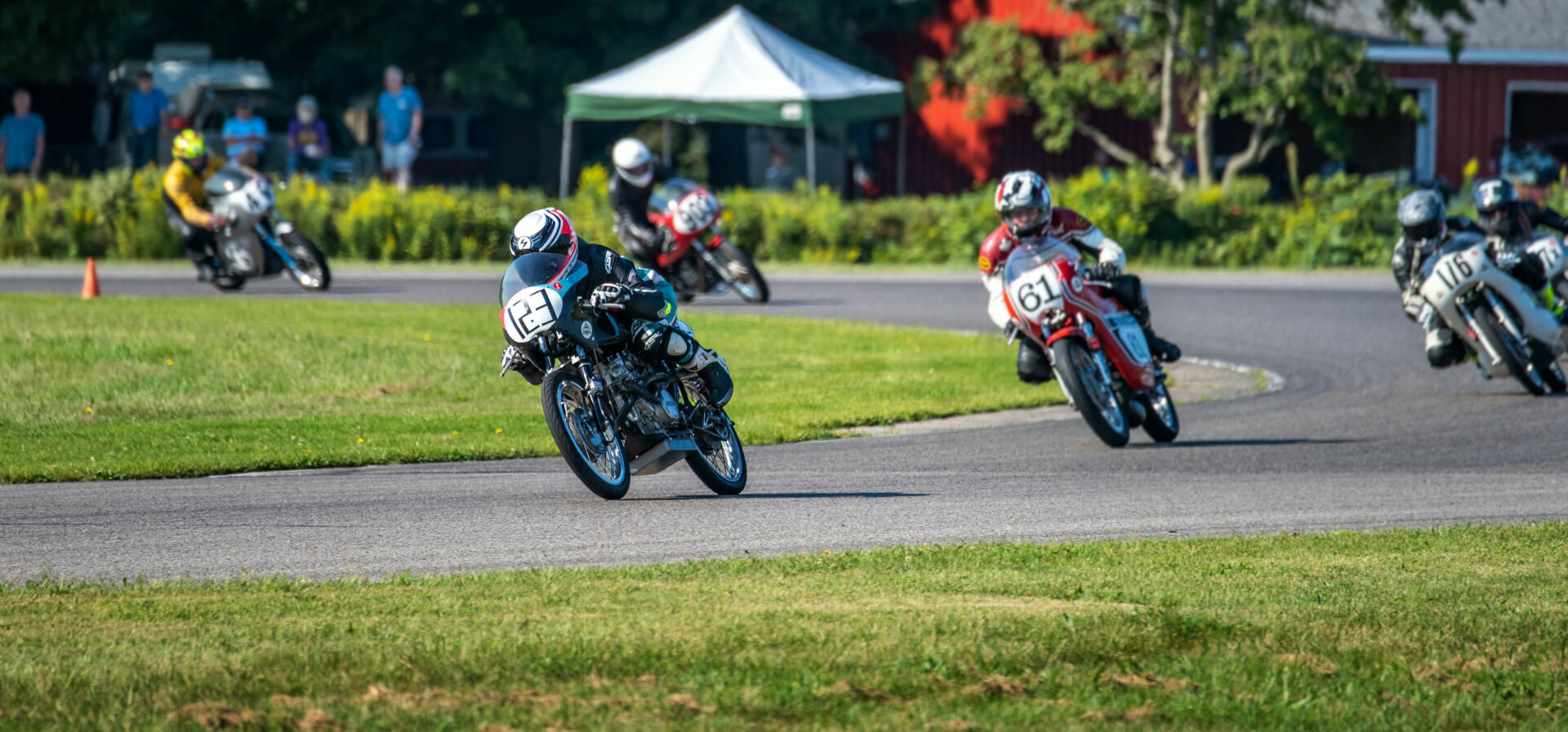 Jonas Stein (123) leads Paul Germain (61), Tony Read (176), and Ross Tuffli (27X) during 250 GP Race One at Gingerman Raceway. Photo by Kevin McIntosh, courtesy AHRMA.