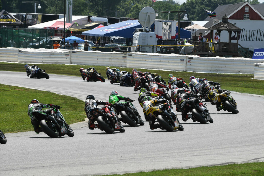 The MotoAmerica Superbike field races past several sections of inflatable Alpina soft barriers provided by the Roadracing World Action Fund. Photo by Brian J. Nelson.