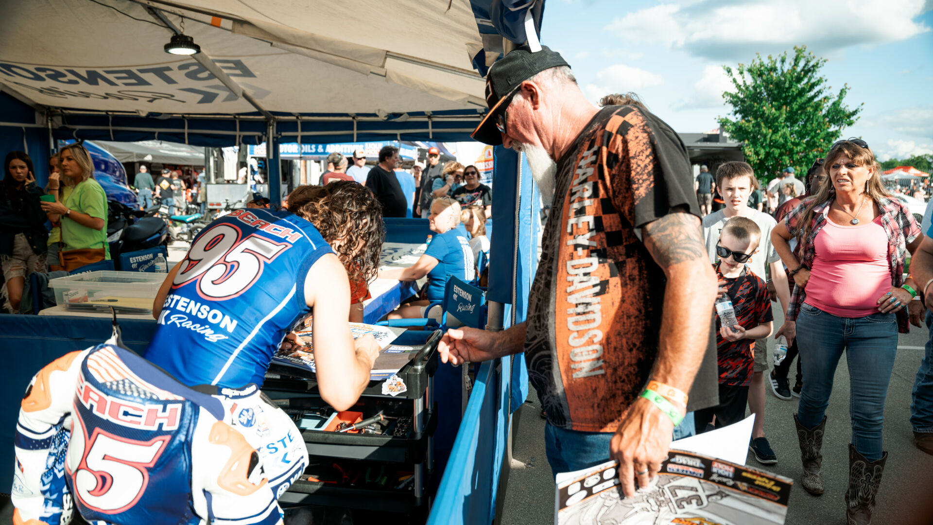 JD Beach (left) signs an autograph for a fan at an American Flat Track (AFT) event earlier in 2022. Photo by Kristin Lassen, courtesy AFT.