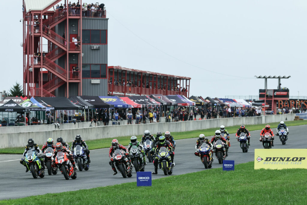 Josh Herrin (2) and Josh Hayes (4) led the Supersport pack into Turn One on Sunday at NJMP. Photo by Brian J. Nelson.