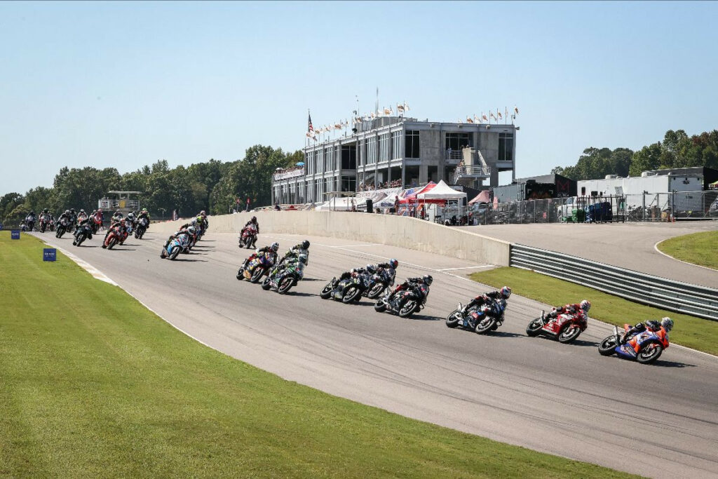 The Yuasa Stock 1000 pack storms into Turn One led by eventual race winner Hayden Gillim (69). Photo by Brian J. Nelson, courtesy MotoAmerica.