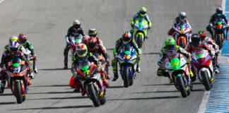 The start of a MotoE race in 2022 with eventual Champion Dominique Aegerter (77) leading on his Energica Ego Corsa electric racebike. Photo courtesy Dorna.