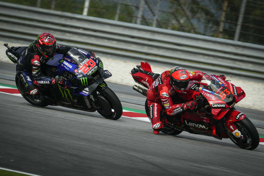 Fabio Quartararo (20) and Francesco Bagnaia (63) in action on Friday at Sepang. Photo courtesy Dorna.