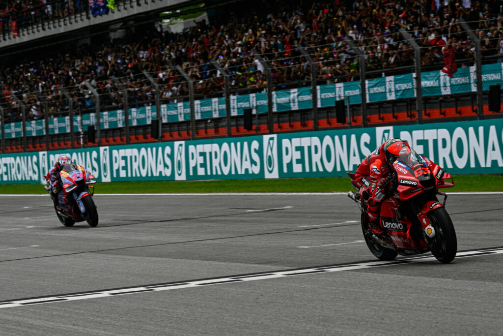 Francesco Bagnaia (63) held off Enea Bastianini (23) to win at Sepang. Photo by Dorna.