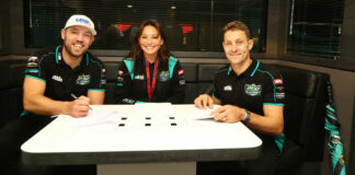 FHO Racing owner Faye Ho (center) with riders Peter Hickman (left) and Josh Brookes (right). Photo courtesy FHO Racing.