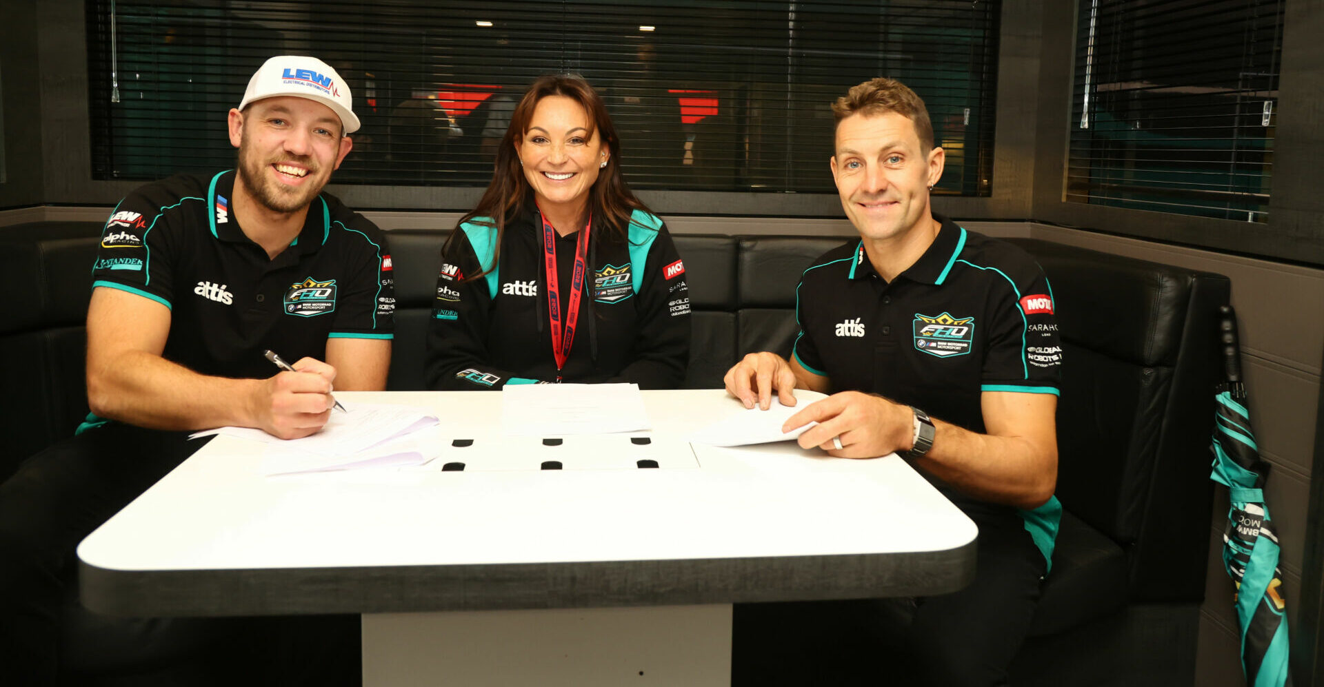 FHO Racing owner Faye Ho (center) with riders Peter Hickman (left) and Josh Brookes (right). Photo courtesy FHO Racing.