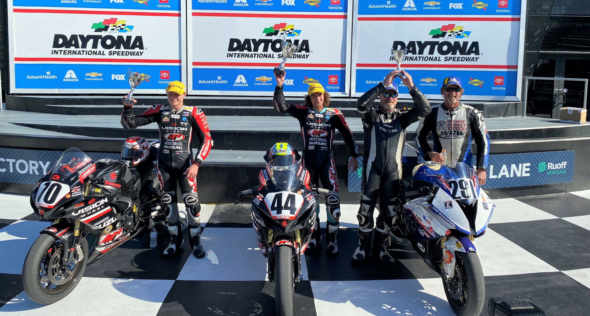 ASRA Team Challenge race winner Vision Wheel M4 ECSTAR Suzuki SA's Sam Lochoff (second from left), runner-up Vision Wheel M4 ECSTAR Suzuki SPS's Tyler Scott (far left), and Grease Monkey Racing's Stephen Hofmann (second from right) and Eric Helmbach (far right), who finished third in the race and won the ASRA Team Challenge overall Championship. Photo by David Swarts.