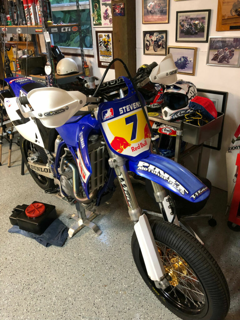 Thomas Stevens' basement/garage with his Yamaha YZ450F supermotard bike and old race leathers hanging in the background before Hurricane Ian. Photo courtesy Thomas Stevens.