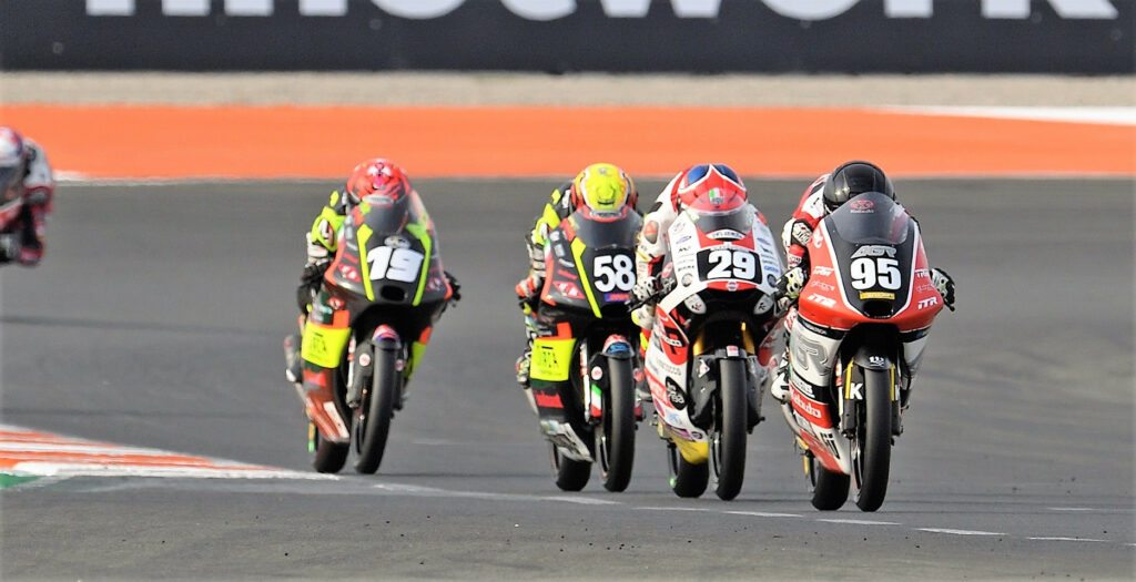 Collin Veijer (95) leads Harrison Voight (29), Luca Lunetta, and Alessandro Morosi (19) during a JuniorGP World Championship session at Valencia. Photo courtesy Dorna.