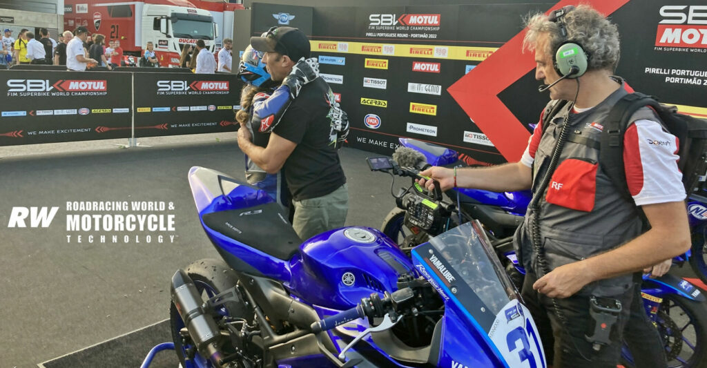 After finishing second in Race Two, Kayla Yaakov is embraced by her father, former racer David Yaakov, in Parc Ferme in Portugal. Photo by Michael Gougis.