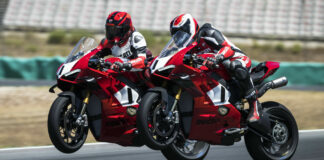 Two Ducati test riders at speed on track on 2023 Panigale V4 R sportbikes. Photo courtesy Ducati.