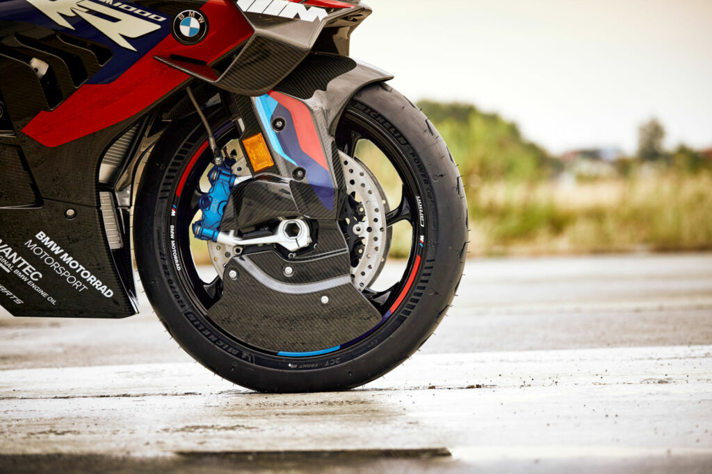 Another part of the 2023 BMW M 1000 RR's new aerodynamic package are brake cooling ducts integrated into the carbon-fiber front fender and carbon-fiber M Aero Wheel Covers. Photo courtesy BMW Motorrad.