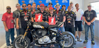 2022 F/S Cup Champion Cory West (left) and 2022 BRL Big Twins Champion Patricia Fernandez (right) with their Bagger Racing League number one plates and their Saddlemen/Lloyd'z Garage team at Daytona. Photo courtesy BRL.
