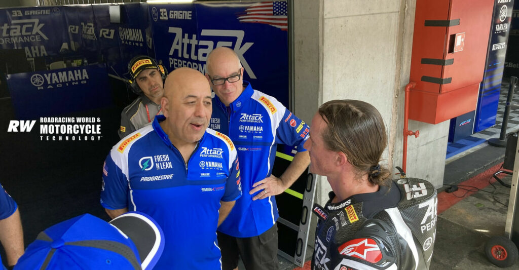A quick debrief and congratulations back at the Attack Racing garage after a hard weekend's work. Photo by Michael Gougis.