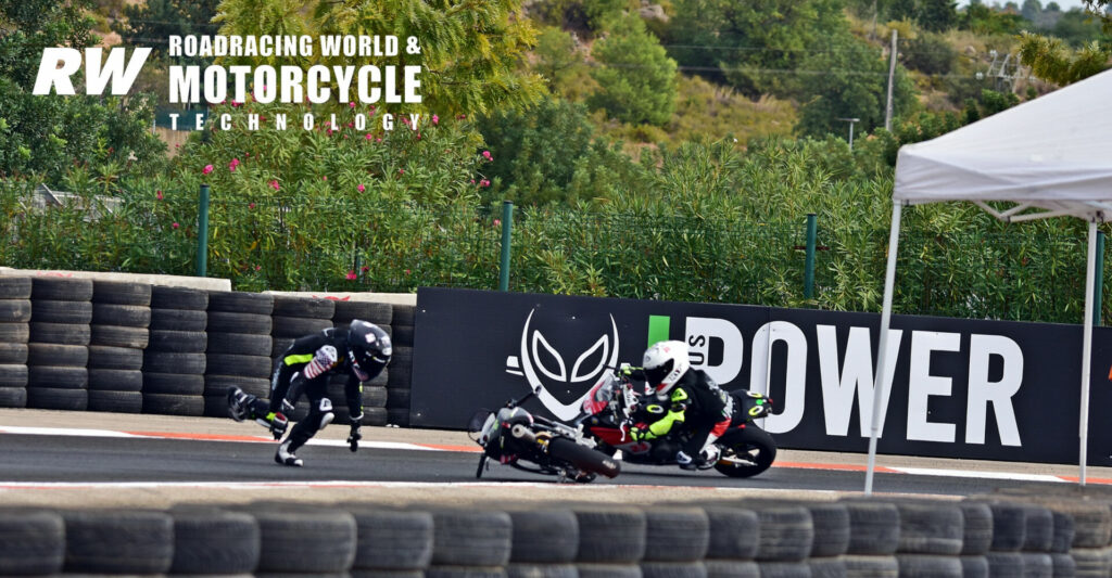 Ryder Davis scrambles for his motorcycle and to avoid oncoming riders after crashing in Race One at the FIM MiniGP World Series race. Photo by Michael Gougis.