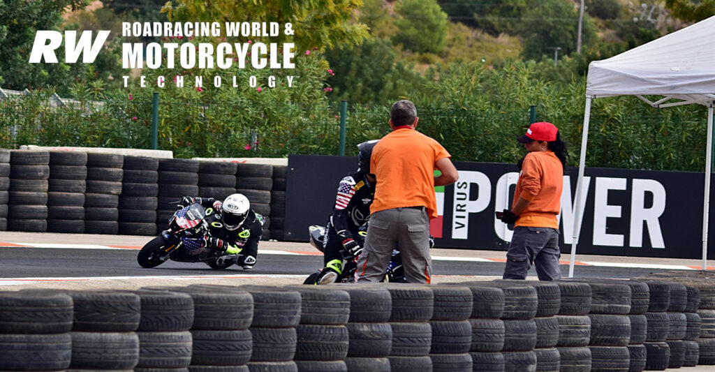 Nathan Gouker (37) rides past as Ryder Davis attempts to restart his machine after crashing in Race One. Photo by Michael Gougis.