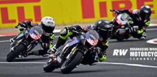 American Ryder Davis (38) leads American Nathan Gouker (37) in Race Two at the FIM MiniGP World Series event in Valencia. Photo by Michael Gougis.