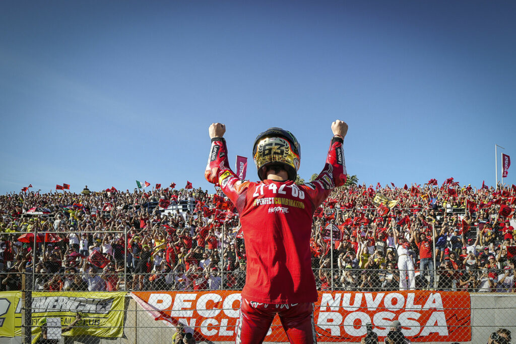 2022 MotoGP World Champion Francesco "Pecco" Bagnaia acknowledges the fans at Valencia. Photo courtesy Dorna.