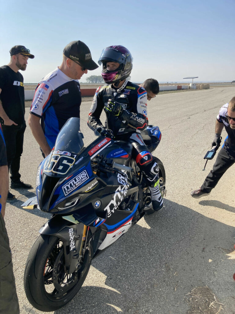 PJ Jacobsen talks to Crew Chief Scott Jensen on pit lane at Buttonwillow. Photo by John Ulrich.