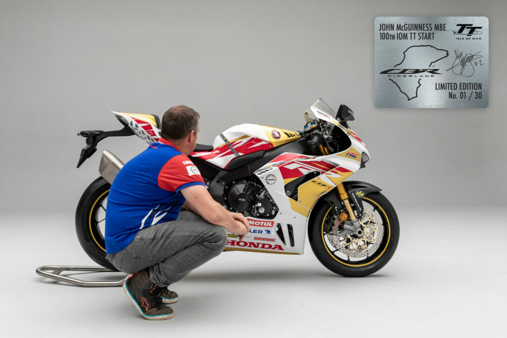 John McGuinness admiring a John McGuinness 100th Start Replica CBR1000RR-R Fireblade SP. Photo courtesy Honda UK.