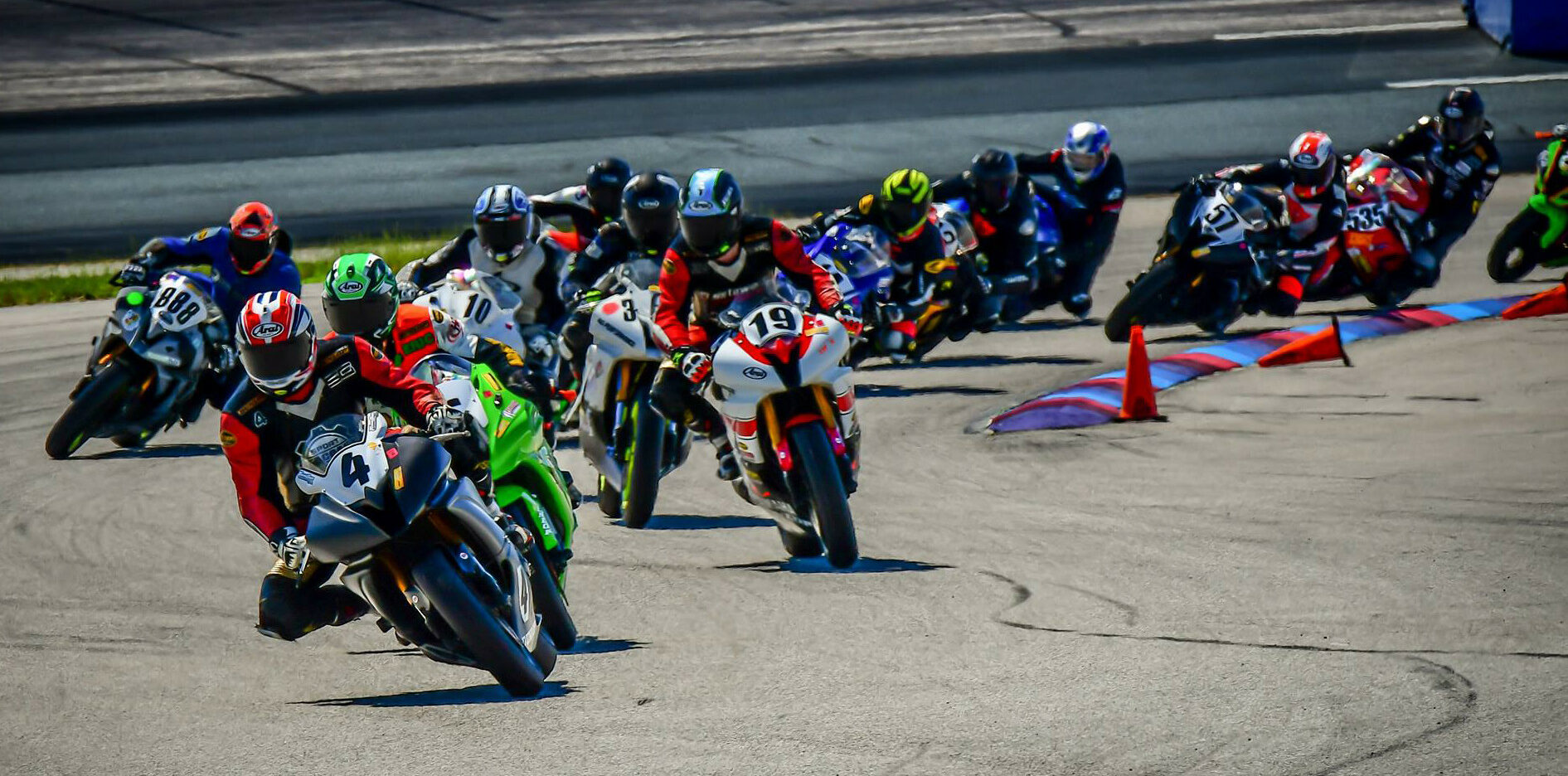 Scott Greenwood (4) leads the start of a NEMRR Middleweight GP race at New Hampshire Motor Speedway. Photo by Martin Hanlon, courtesy NEMRR.