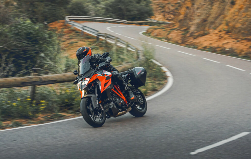 A 2023 KTM 1290 Super Duke GT fitted with optional side cases at speed. Photo courtesy KTM North America.
